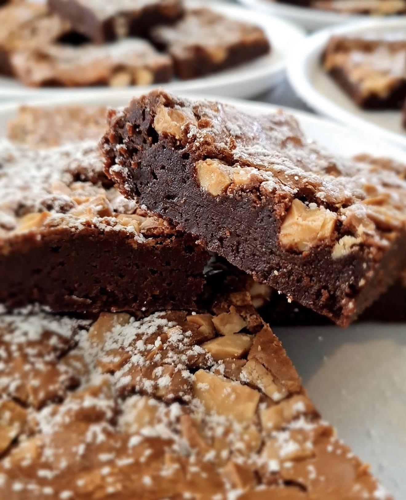 Margie’s rich chocolate brownies, with gooey centres, nuts and a delicate dusting of icing sugar